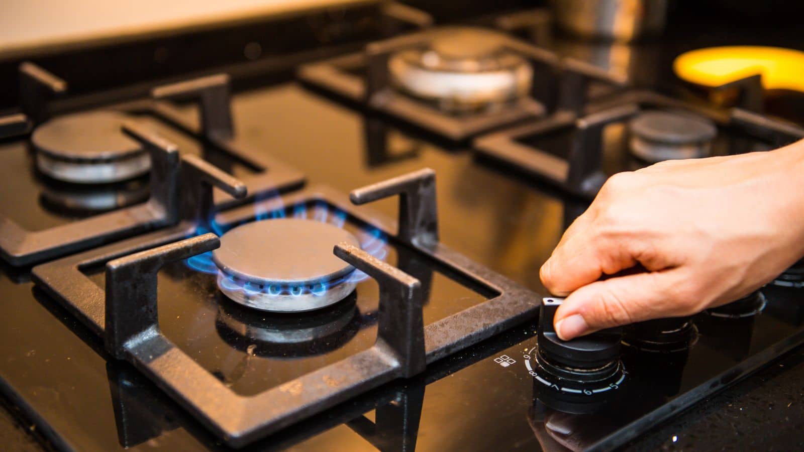 Turning on a stove.